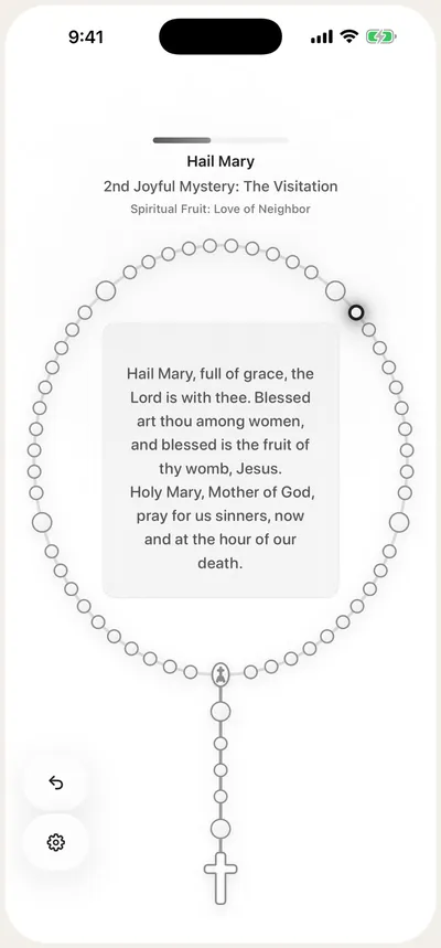 Marian guided Rosary screen showing the Hail Mary text inside a circle of rosary beads